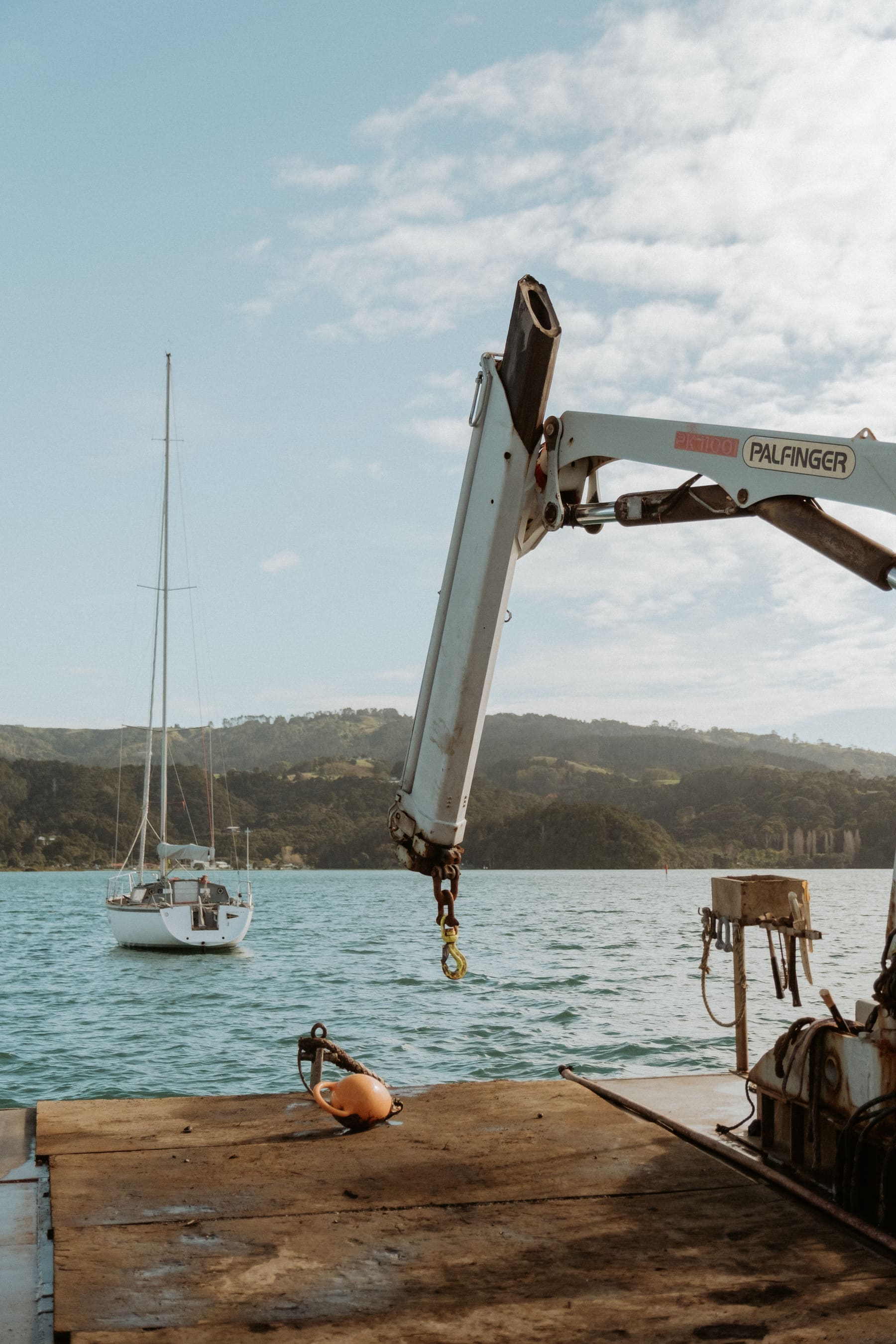 Working vessel alongside a moored boat